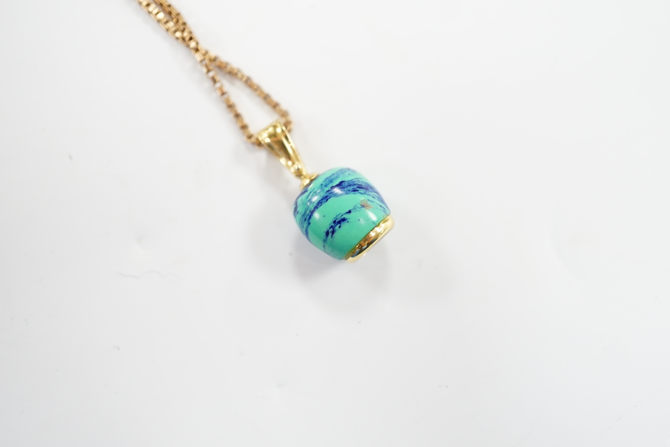 A modern 750 yellow metal, baroque pearl and enamelled charm, 14mm, on a 9ct chain, 56cm, gross weight 7.6 grams.